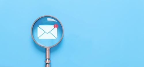 Magnifying glass highlighting an email notification icon with one new message on a blue background