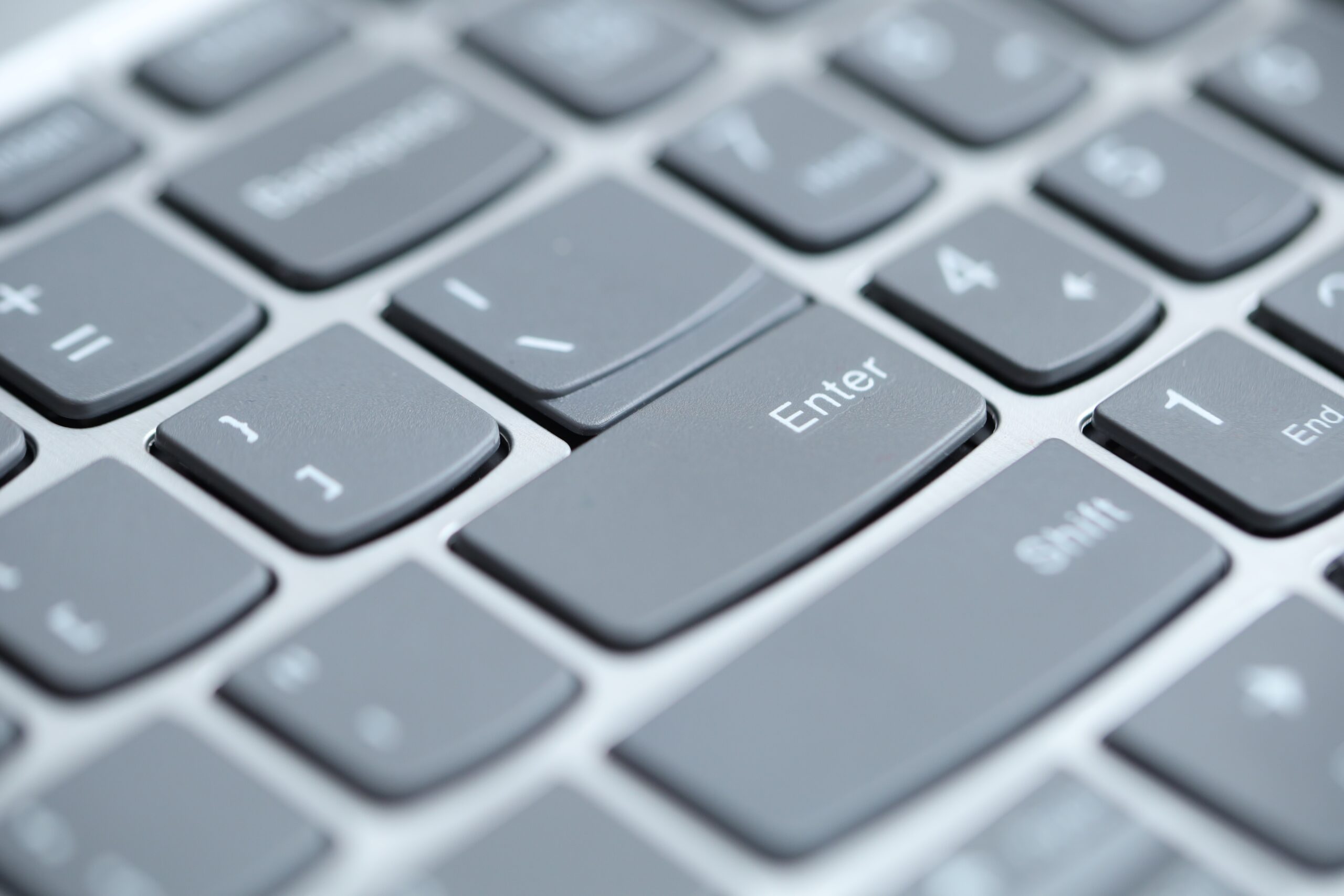 Close-up view of laptop keyboard with focus on Enter key