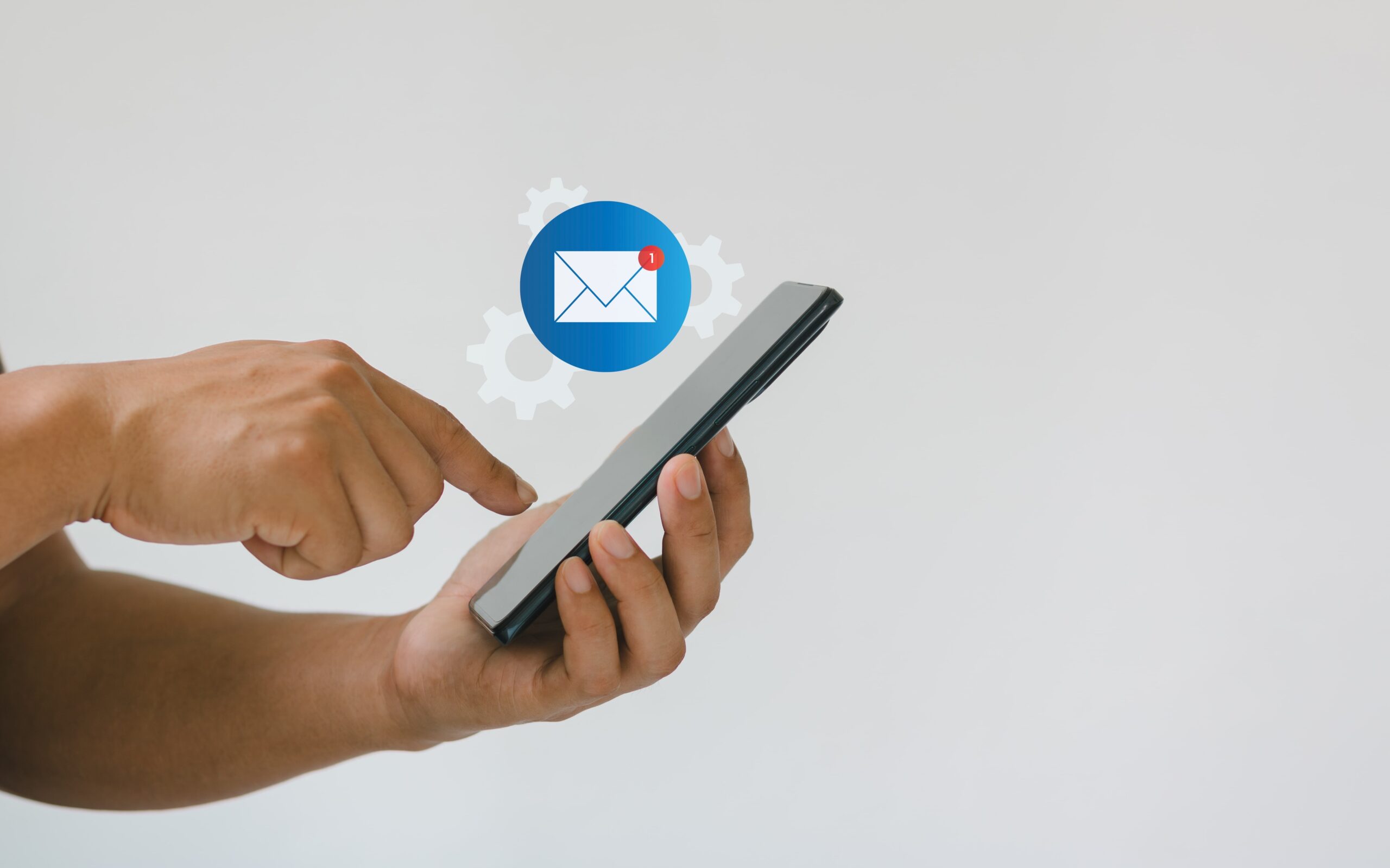 Hands holding phone with blue email icon