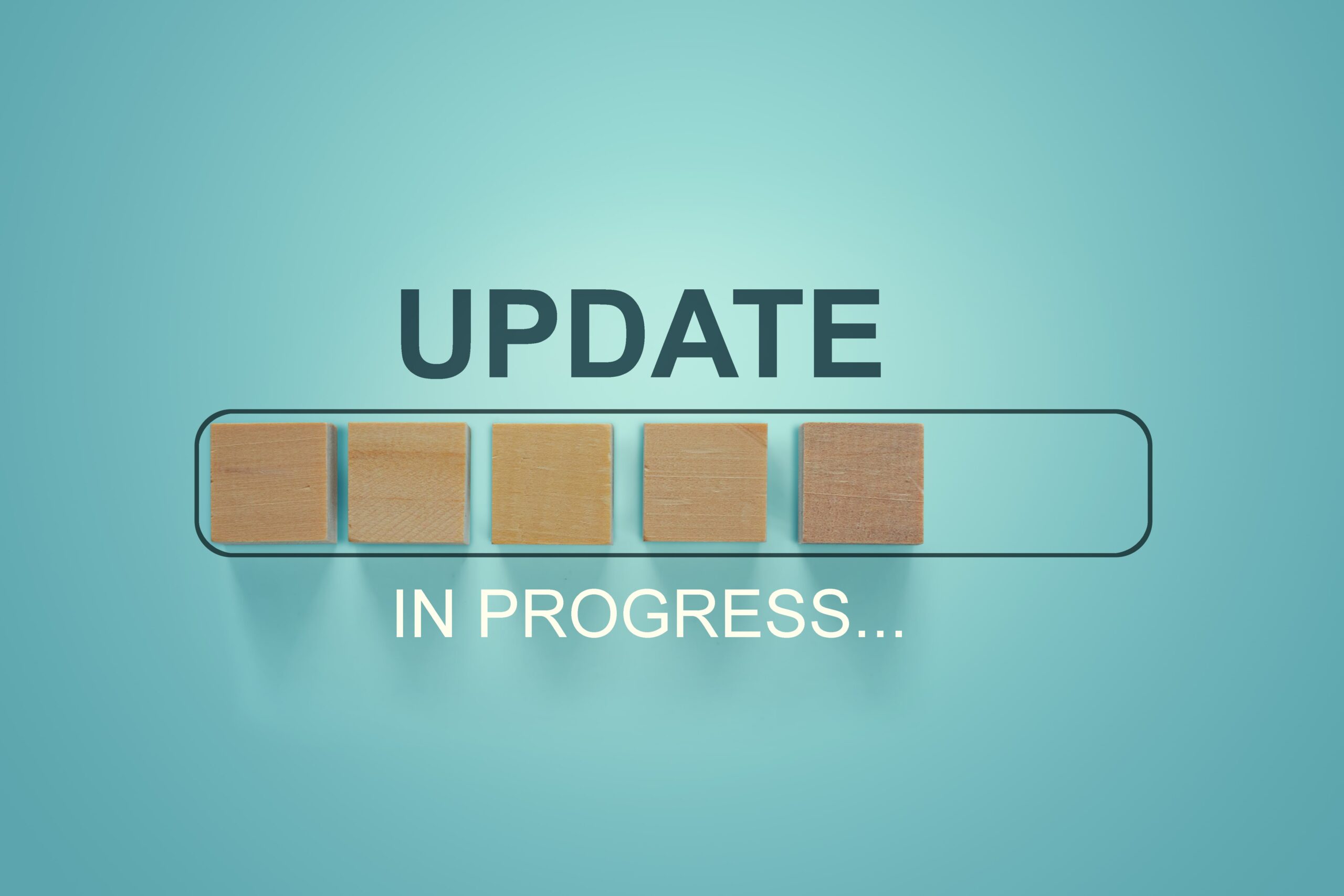 Blue background and wooden blocks symbolizing "update in progress"