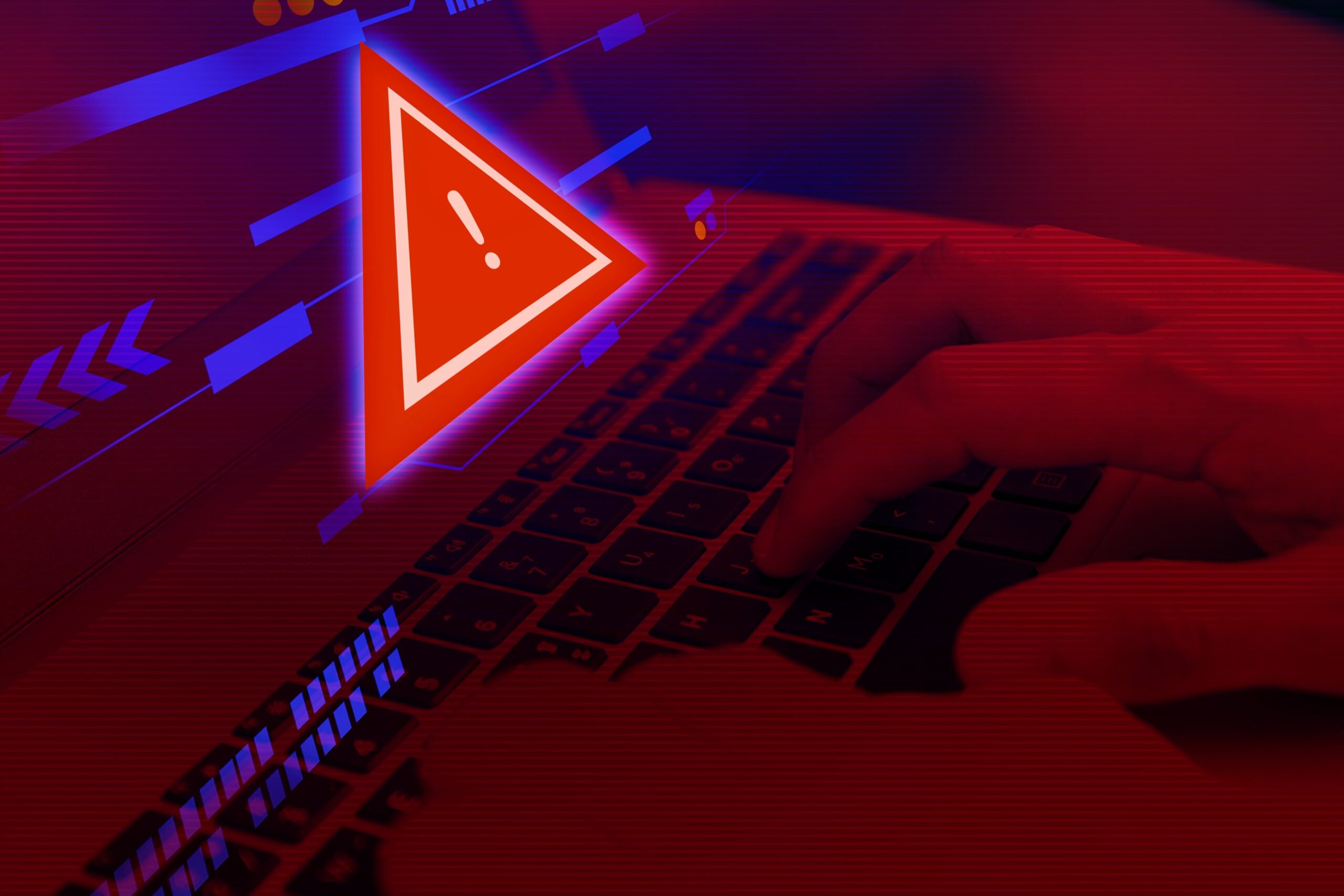 red glowing triangle in front of laptop