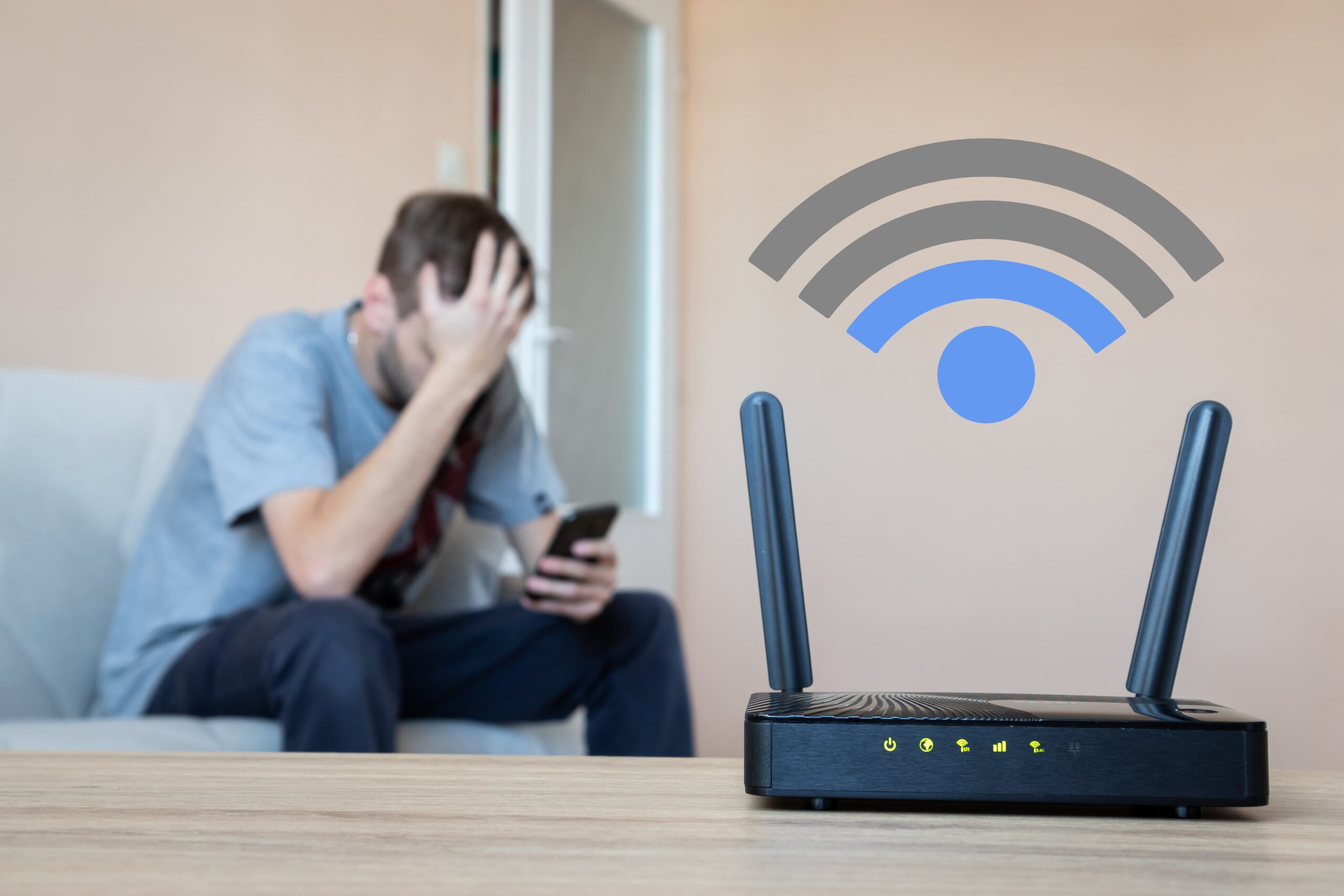 A frustrated man sitting on the couch and a modem showing a low internet connection.