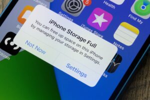Phone with message on screen "iPhone Storage Full"