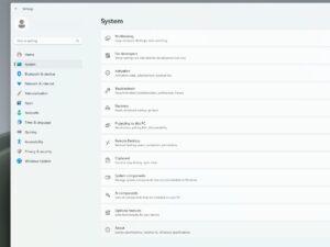 Windows 11 System Settings menu open, showing options like Multitasking, Activation, Recovery, and AI components.