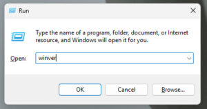 Windows Run dialog box open with the command “winver” typed in the text field.