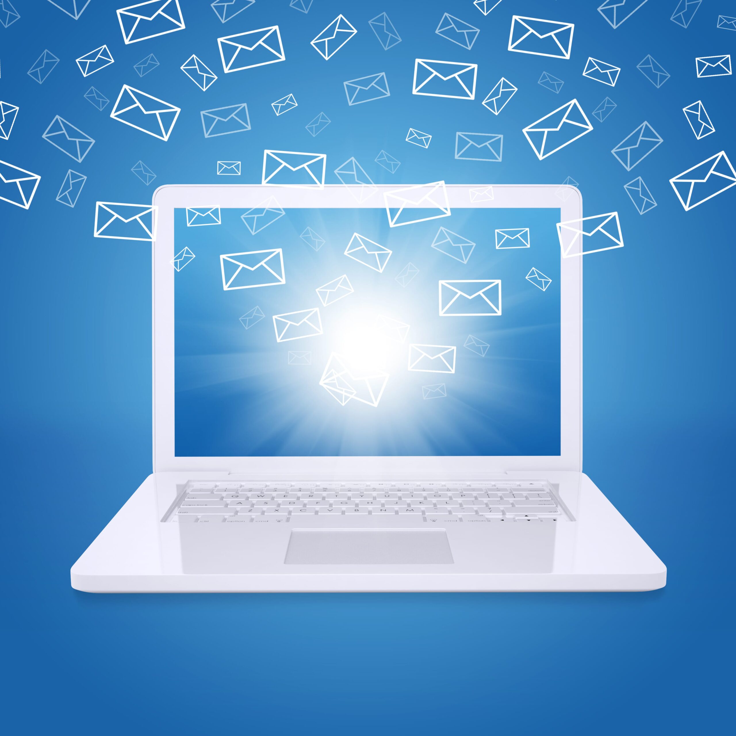 Laptop with glowing screen and flying envelope icons, symbolizing high-volume email communication or email marketing