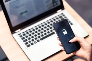 An overview of an individual entering a passcode sequence on their mobile device.