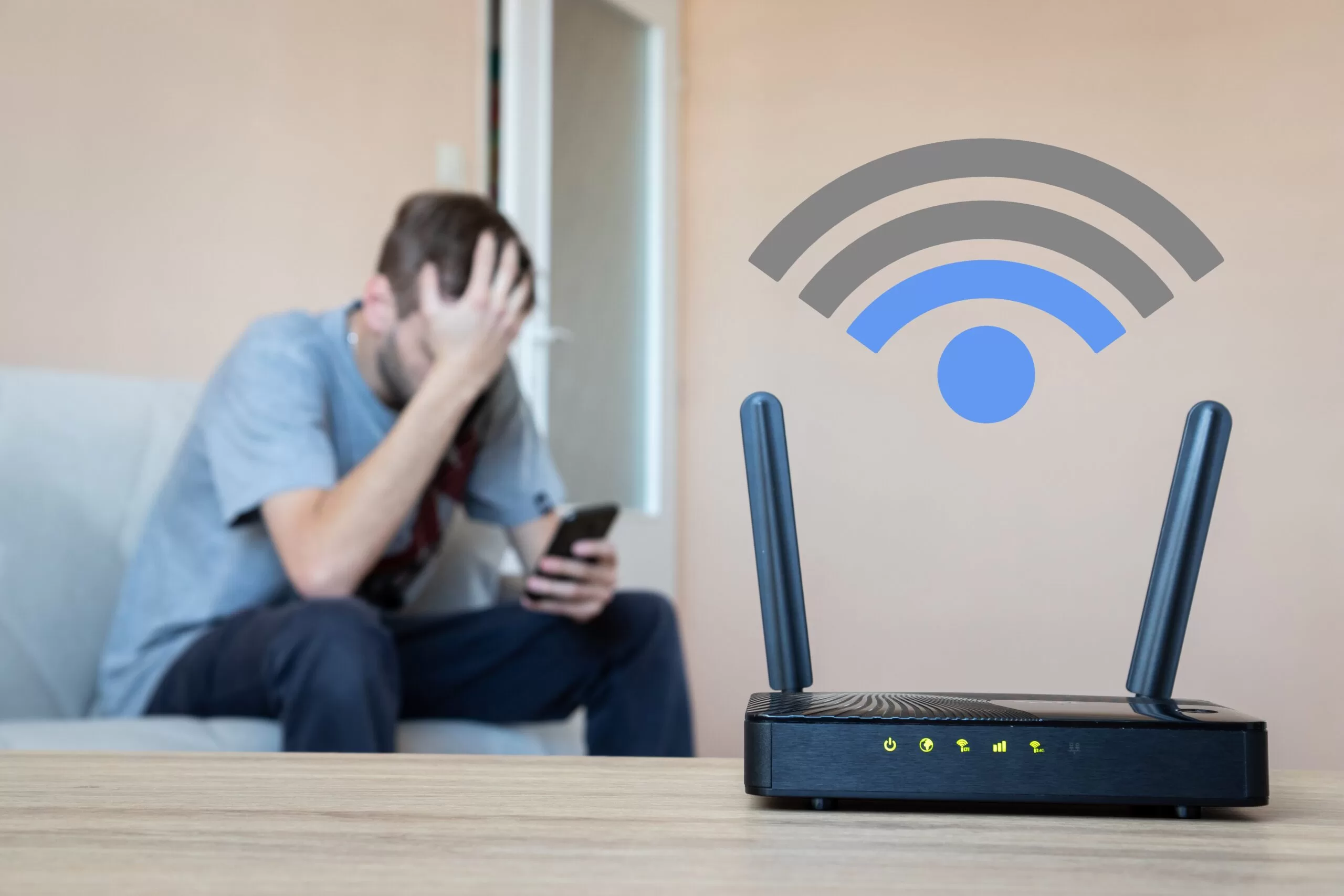 A frustrated man sitting on the couch and a modem showing a low internet connection.