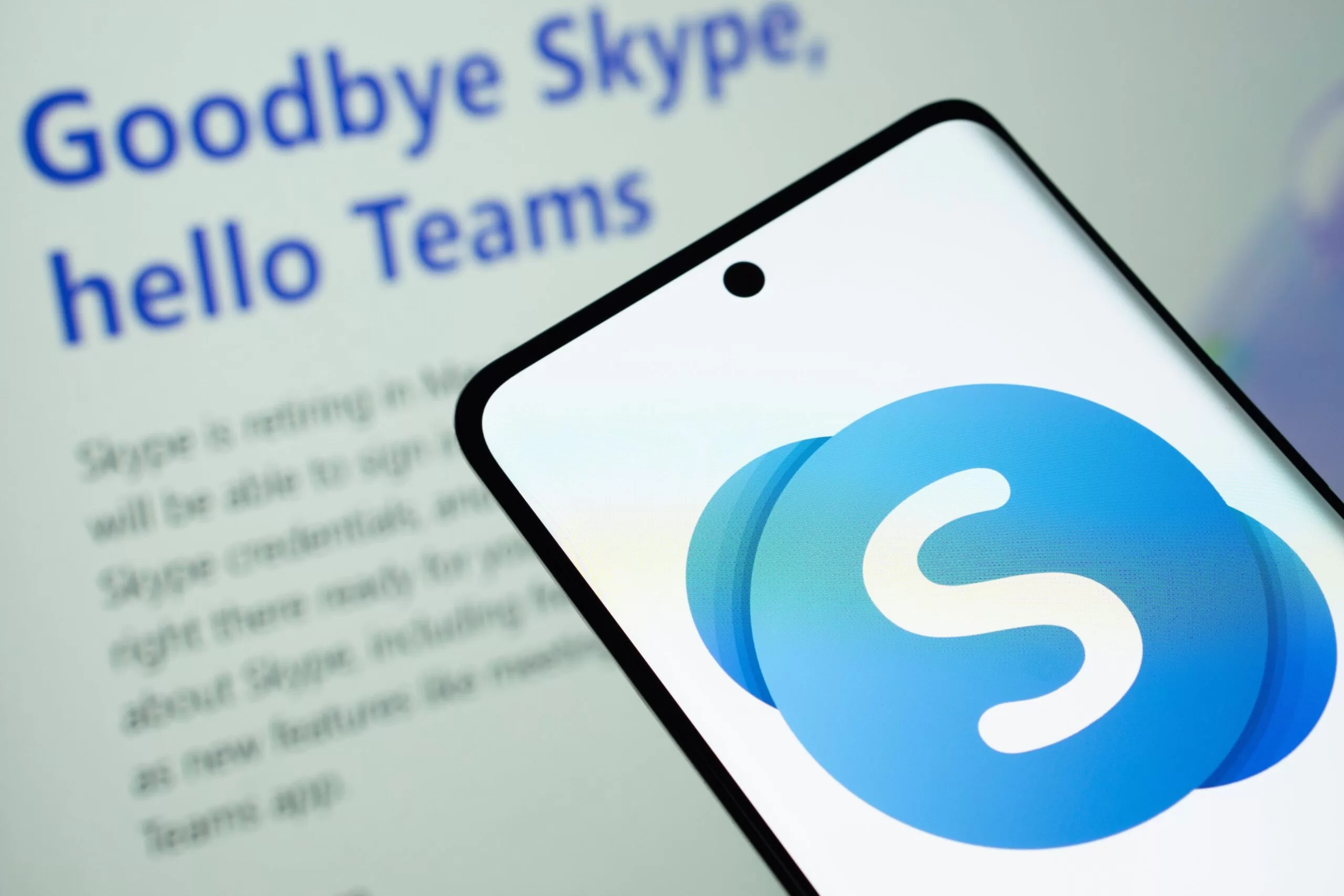 Phone with Skype logo, laptop with screen that says "Goodbye Skype, Hello Teams"