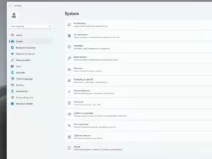 Windows 11 System Settings menu open, showing options like Multitasking, Activation, Recovery, and AI components.
