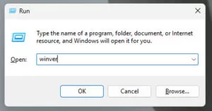 Windows Run dialog box open with the command “winver” typed in the text field.