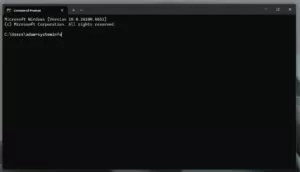 Windows Command Prompt displaying system version information with the command “systeminfo” typed.