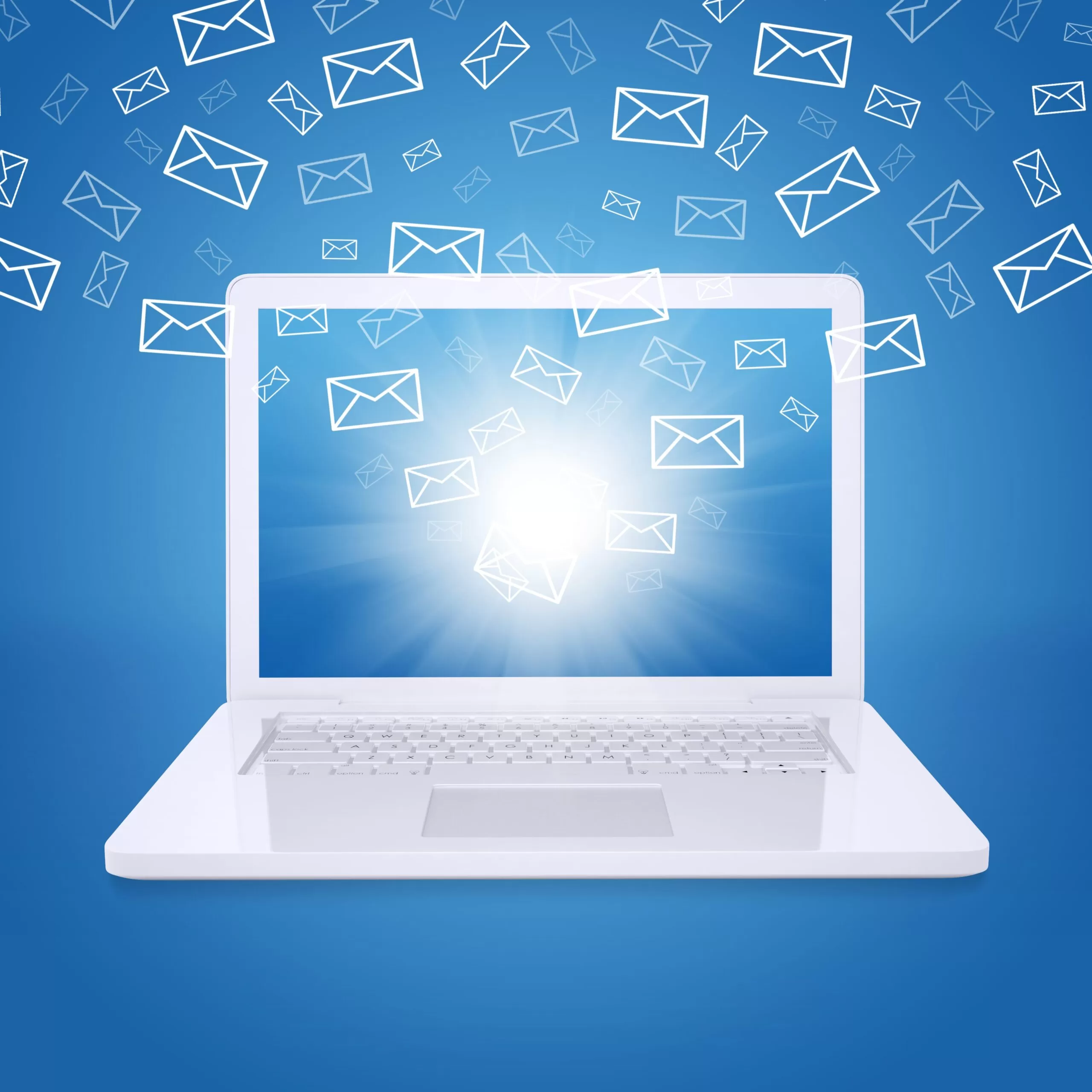 Laptop with glowing screen and flying envelope icons, symbolizing high-volume email communication or email marketing